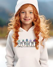 Load image into Gallery viewer, Kids or Youth Christmas Hooded Sweatshirt, Waddling In A Winter Wonderland Hoodie, Cozy, Warm Sweatshirt, Pastel Penguins on a cute hoodie