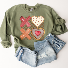 Load image into Gallery viewer, Valentine's Day XOXO Women's Heavy Blend™ Crewneck Sweatshirt Pastel Valentine Cookies on a Green Pullover or T-Shirt Watercolor Cookies