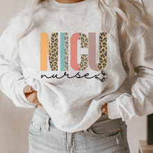 Load image into Gallery viewer, Women's NICU Nurse Crewneck Sweatshirt Winter Neonatal ICU on a Soft, Cozy Pullover Unisex-Size Sweatshirt in White, Sand, or Ash