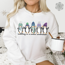 Load image into Gallery viewer, Waddling In A Winter Wonderland Women's Unisex Crewneck Sweatshirt Cute Winter Penguins in Hats and Scarves Funny Winter
