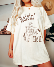 Load image into Gallery viewer, Women&#39;s Raisin&#39; Hell Comfort Colors® Shirt, Trendy Western Cowboy T-Shirt, Garment Dyed T-Shirt, Bachelorette Party Shirt
