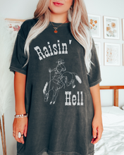 Load image into Gallery viewer, Women&#39;s Raisin&#39; Hell Comfort Colors® Shirt, Trendy Western Cowboy T-Shirt, Garment Dyed T-Shirt, Bachelorette Party Shirt
