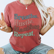 Load image into Gallery viewer, Breathe Hustle Manifest Repeat Tee, 70&#39;s Comfort Colors® T-shirt, Spring1970&#39;s Retro Design T-Shirt in Five Colors, Trendy Summer Seventies Tee
