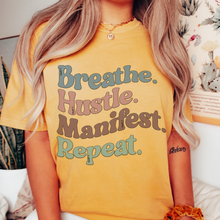 Load image into Gallery viewer, Breathe Hustle Manifest Repeat Tee, 70&#39;s Comfort Colors® T-shirt, Spring1970&#39;s Retro Design T-Shirt in Five Colors, Trendy Summer Seventies Tee
