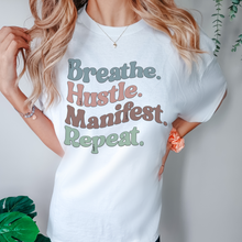 Load image into Gallery viewer, Breathe Hustle Manifest Repeat Tee, 70&#39;s Comfort Colors® T-shirt, Spring1970&#39;s Retro Design T-Shirt in Five Colors, Trendy Summer Seventies Tee
