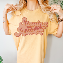 Load image into Gallery viewer, Staying Alive Seventies Tee, 70's Comfort Colors® T-shirt, Spring1970's Retro Design T-Shirt in Six Colors, Trendy Summer Seventies Tee
