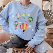 Load image into Gallery viewer, Women&#39;s Beautiful Watercolor Hot Air Balloons Unisex Crewneck Sweatshirt Hot Air Balloon Festival Pullover in White, Sand, Ash, Blue or Pink

