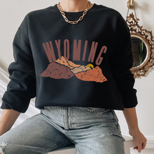 Load image into Gallery viewer, Women's Wyoming Mountains Crewneck Sweatshirt Distressed Wyoming Design in a Cozy, Warm Winter Adventure Camping Hiking Pullover
