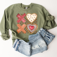 Load image into Gallery viewer, Valentine&#39;s Day XOXO Women&#39;s Heavy Blend™ Crewneck Sweatshirt Pastel Valentine Cookies on a Green Pullover or T-Shirt Watercolor Cookies
