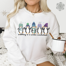 Load image into Gallery viewer, Waddling In A Winter Wonderland Women&#39;s Unisex Crewneck Sweatshirt Cute Winter Penguins in Hats and Scarves Funny Winter
